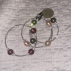 Murano glass bead bracelets with 3 individuals.
